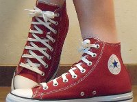 Chili Paste Red High Top Chucks  Wearing chili paste red high tops, left side view 2.